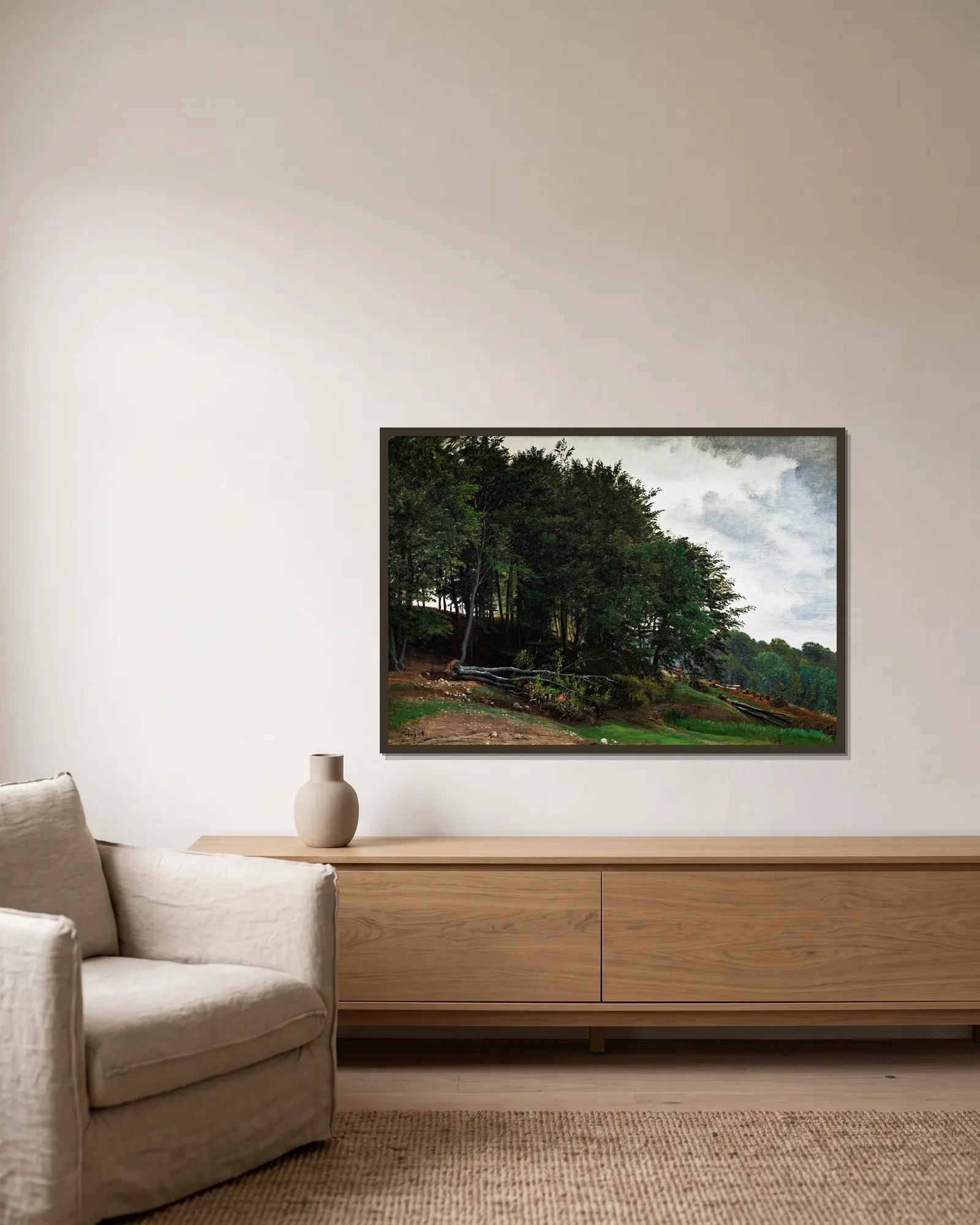 Forested hills av P. C. Skovgaard inramad på en vägg