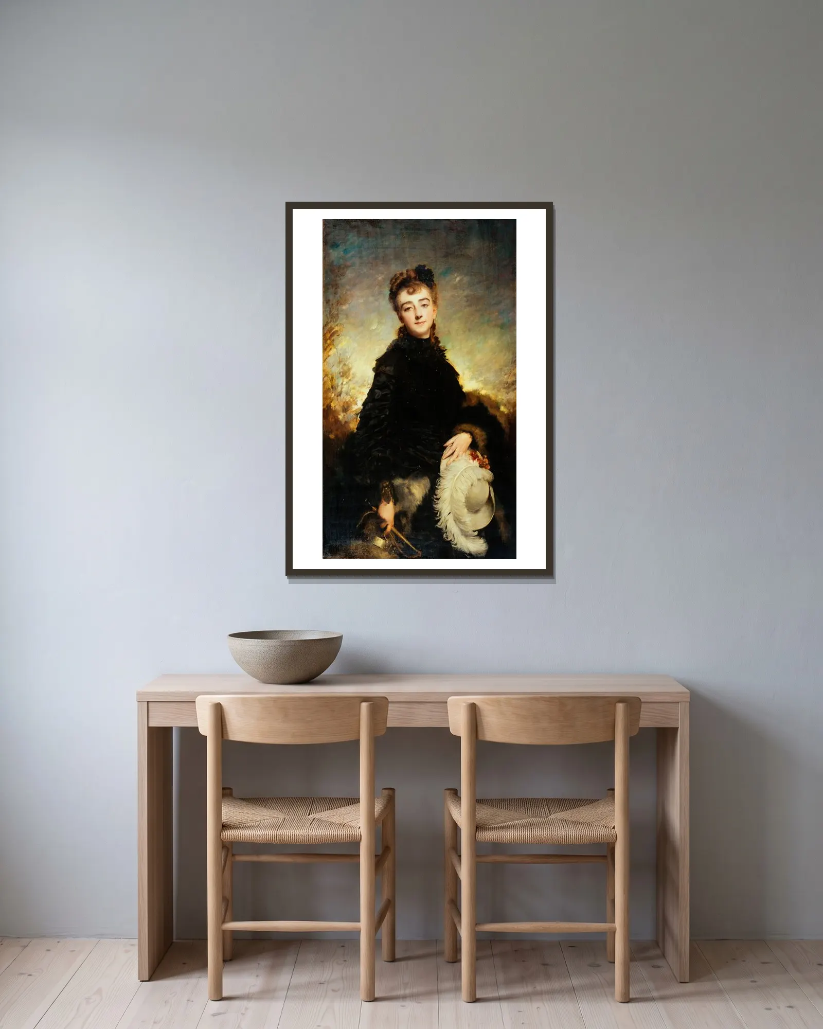 Portrait de femme av Charles Chaplin inramad på en vägg