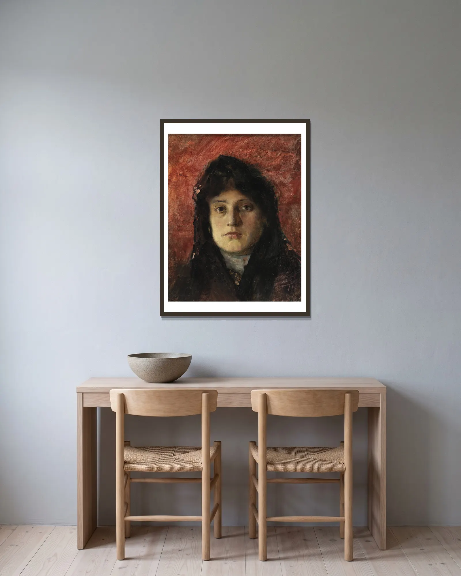 Tete de Femme av Frank Edwin Scott inramad på en vägg