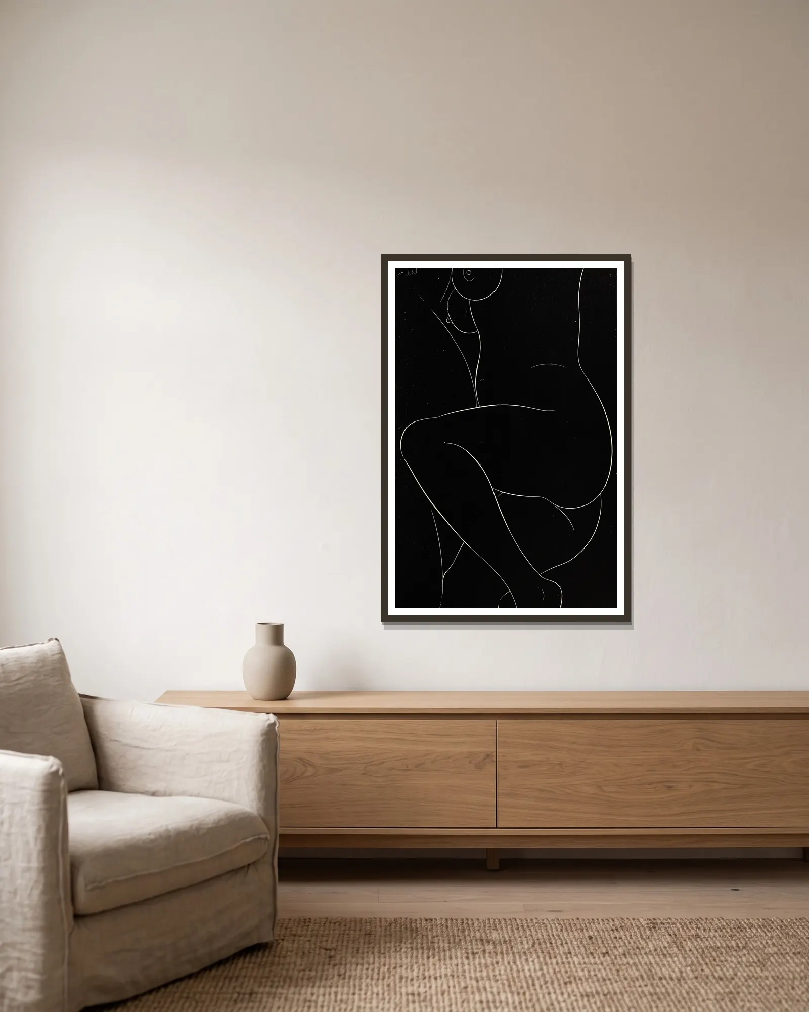 Twenty-five nudes Pl 23 av Eric Gill inramad på en vägg
