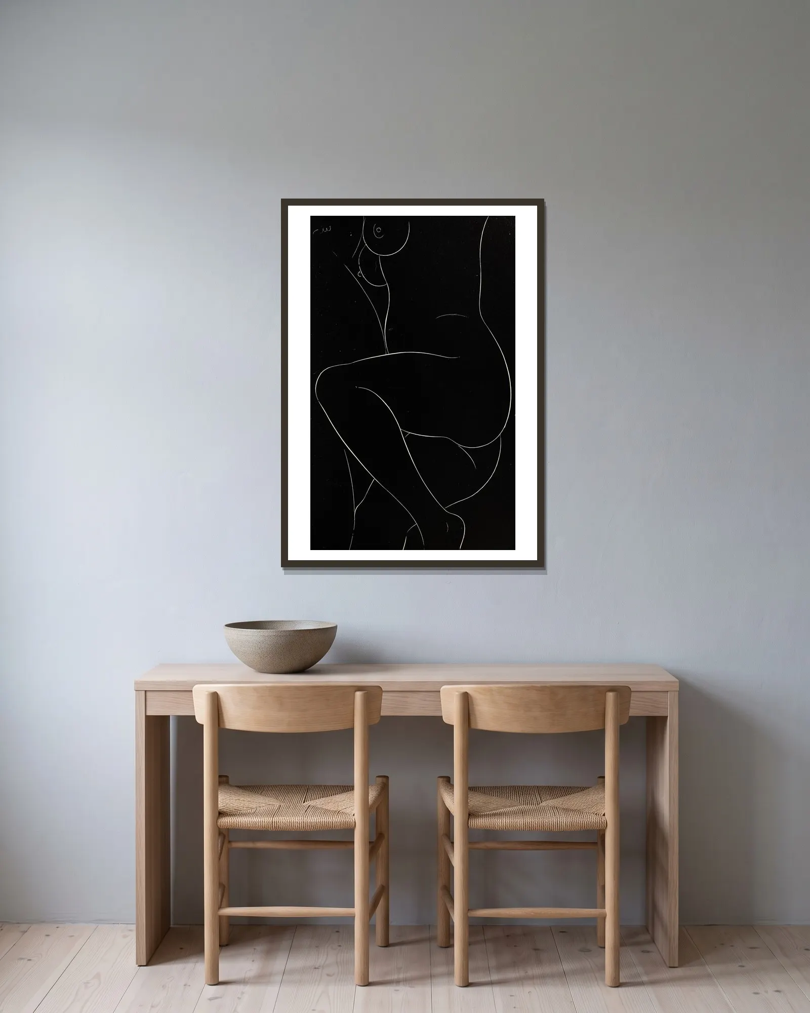 Twenty-five nudes Pl 23 av Eric Gill inramad på en vägg