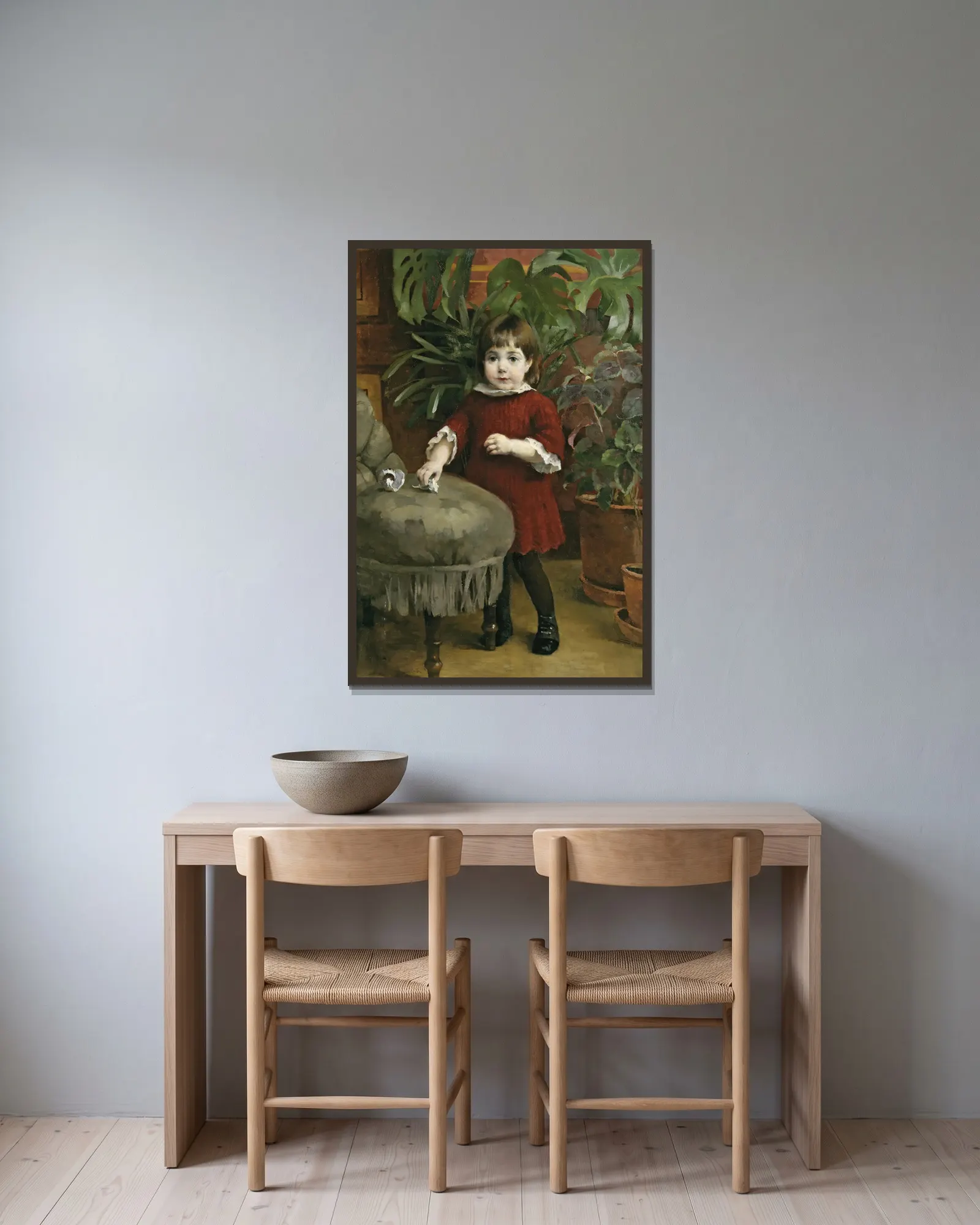Little Gudrun av Helene Schjerfbeck inramad på en vägg