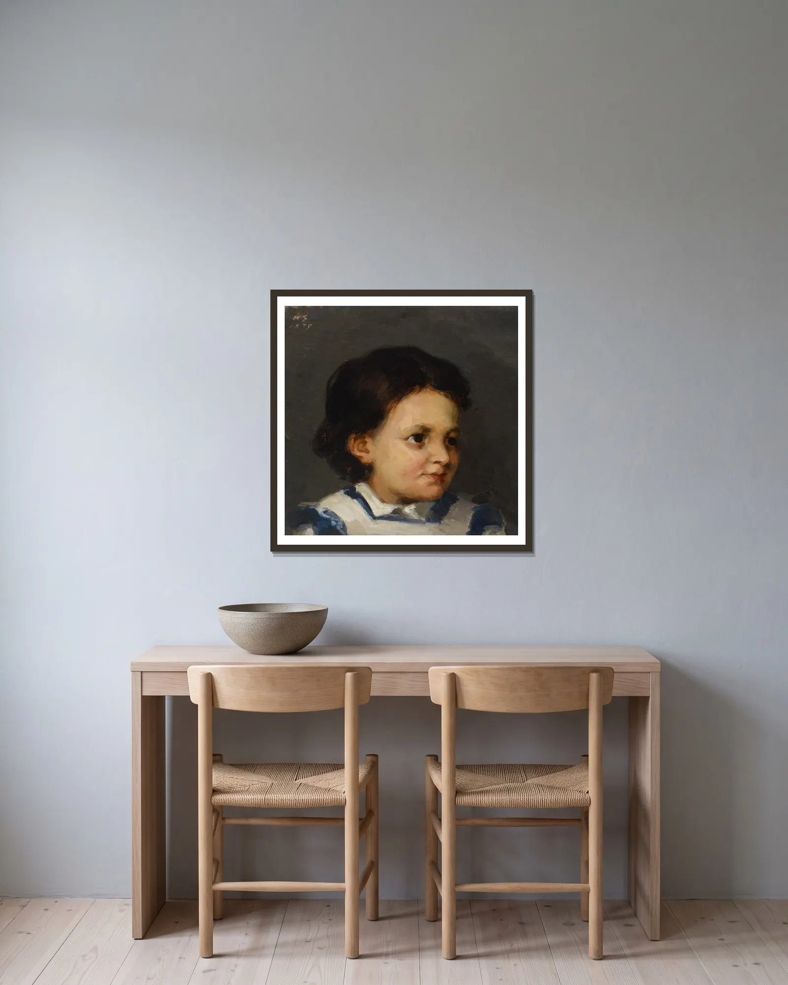 Little Liisa av Helene Schjerfbeck inramad på en vägg