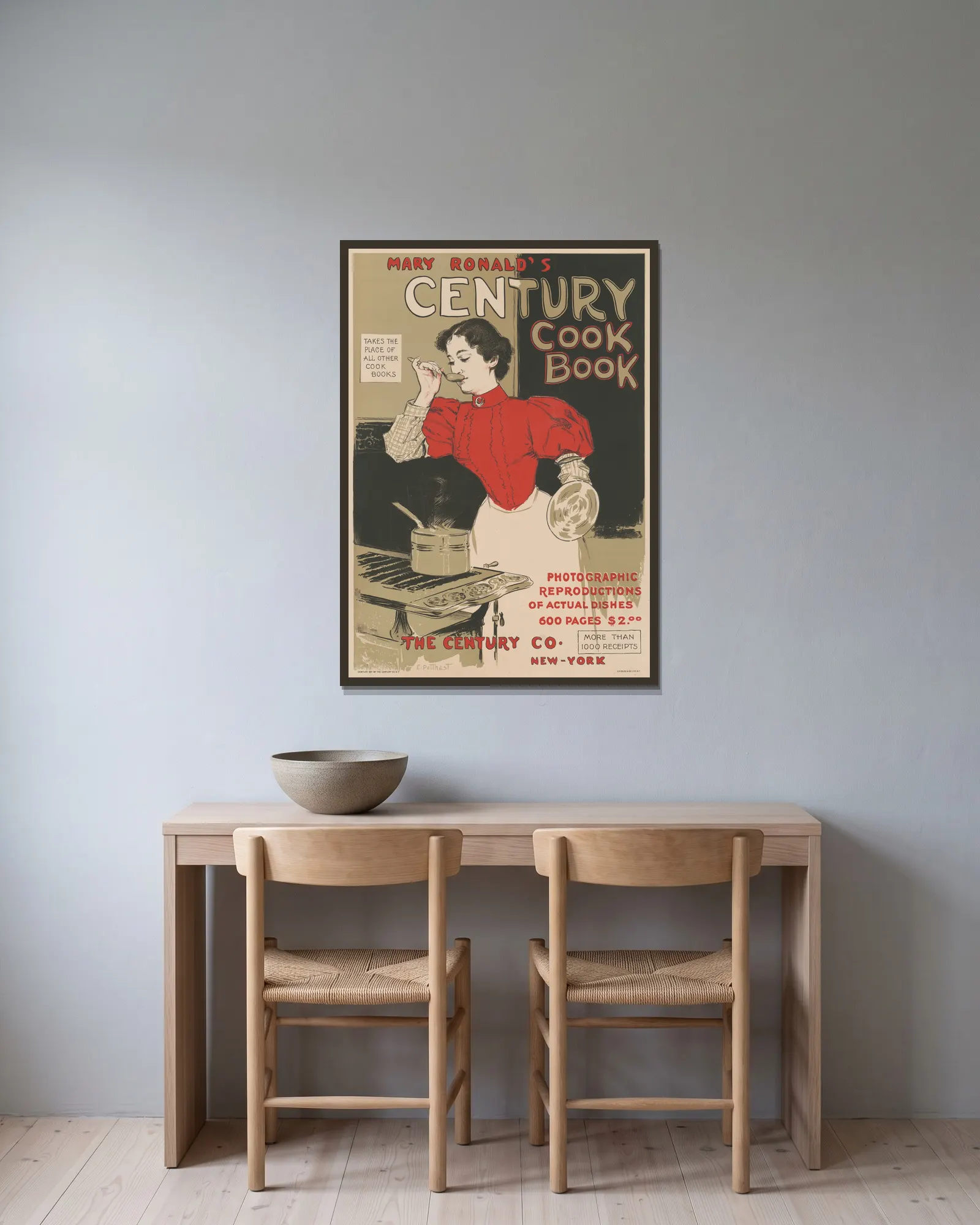 Mary Ronald’s century cookbook av Edward Henry Potthast inramad på en vägg