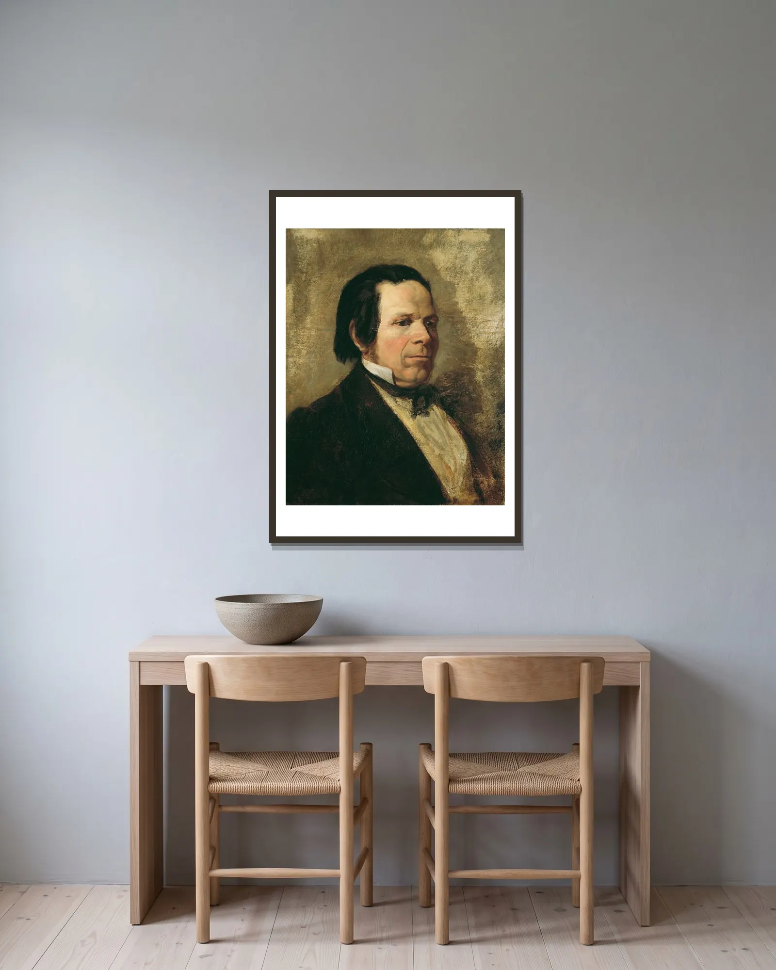 Porträt eines Mannes av Josef Danhauser inramad på en vägg