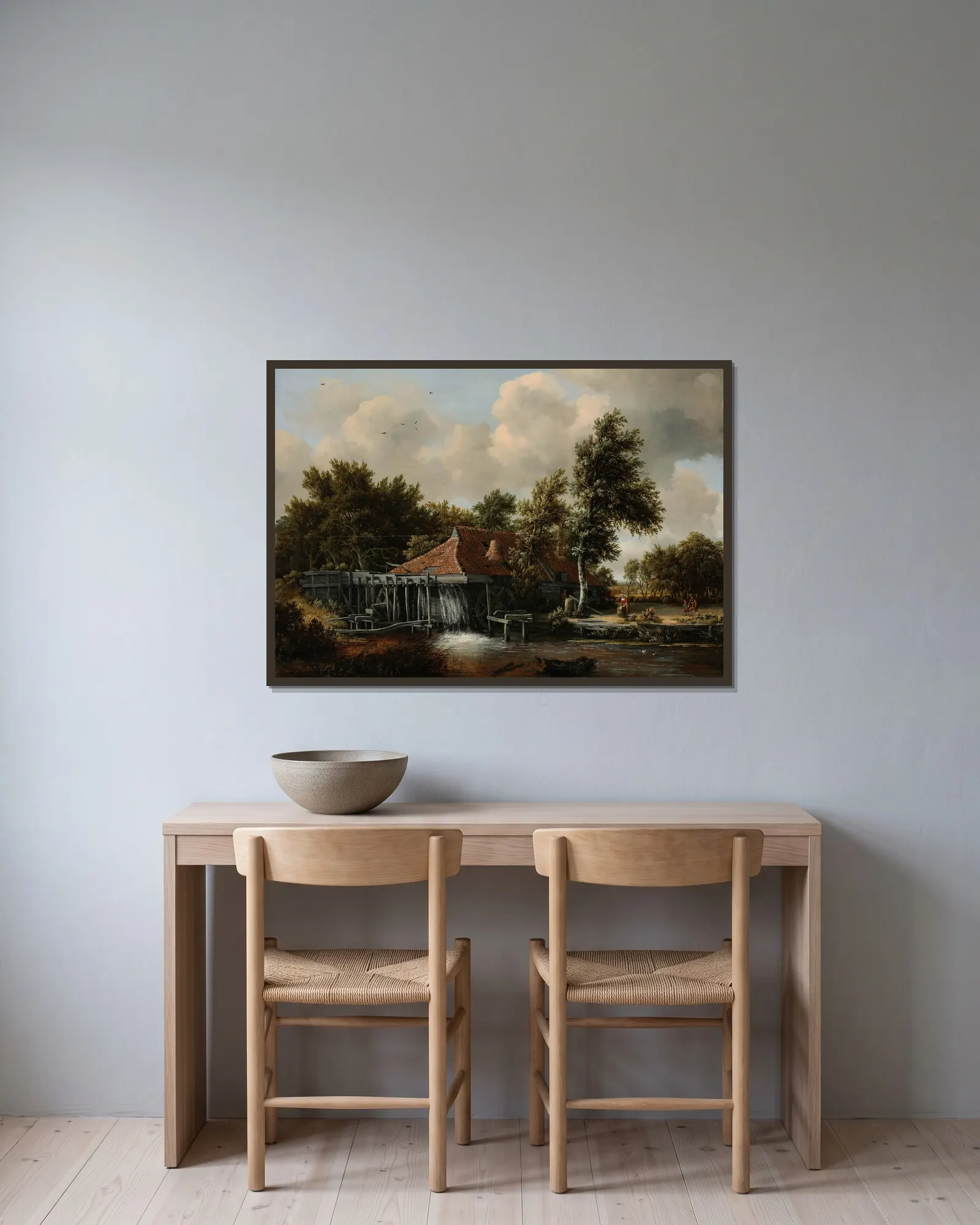 A Watermill av Meindert Hobbema inramad på en vägg