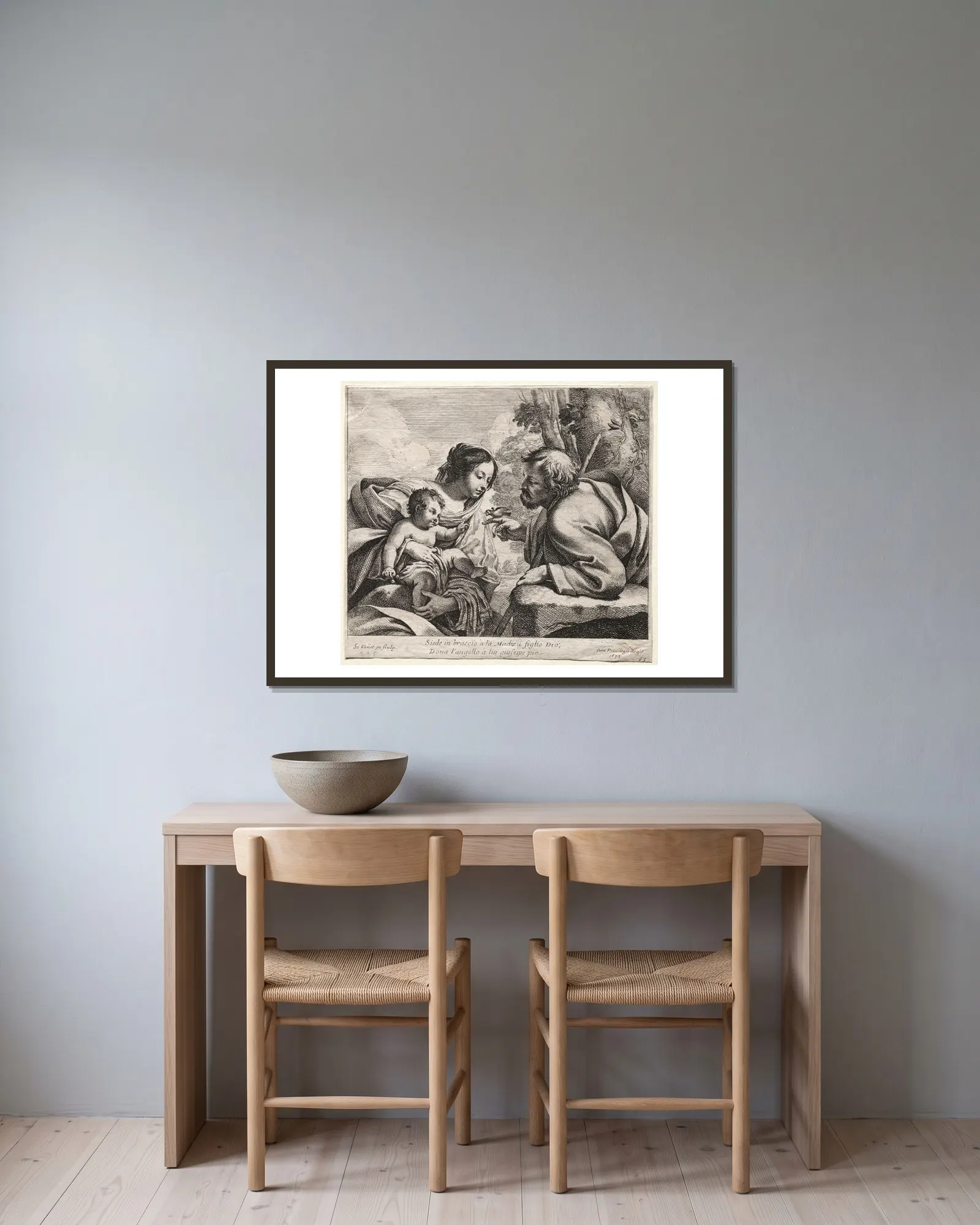 Holy Family av Simon Vouet inramad på en vägg