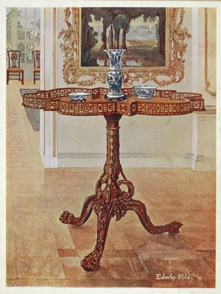 Shaped fret-rimmed gallery table av Edwin Foley