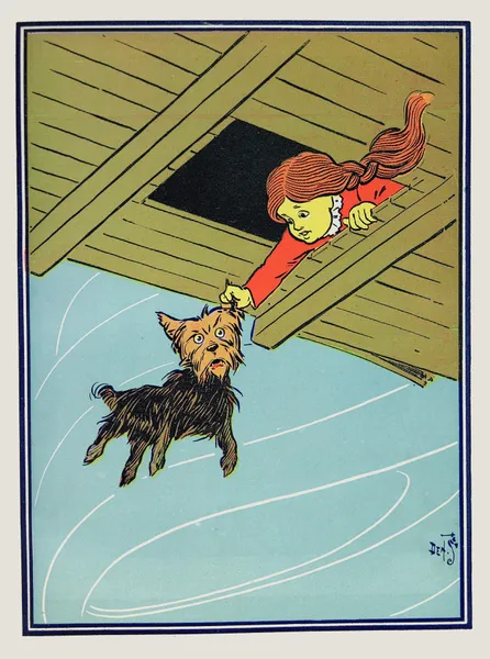 She caught Toto by the ear av William Wallace Denslow